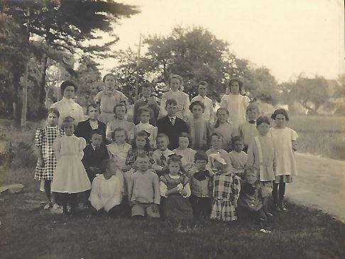 Teacher Isabel M. Adams with her students at the Nobscot school, May 1910